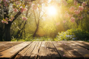Naklejka na ściany i meble An empty wooden table in springtime in sunny rays.