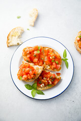 Traditional tomato bruschetta with greens