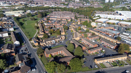 Obraz premium Aerial photo of the village of the town of Hunslet in Leeds West Yorkshire in the UK, showing roads and rows of residential houses, taken in the summer time.