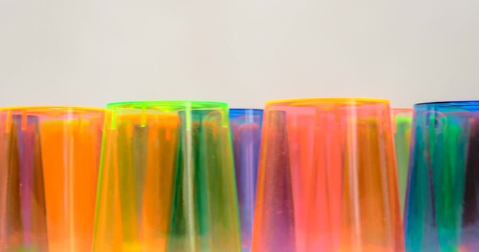 Colorful empty plastic cups set on a rotation table