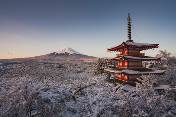 Fujiyoshida, Japan Beautiful view of mountain Fuji and Chureito pagoda at sunrise of Mount Fuji during winter.This is one of the famous spot to take pictures of Mount Fuji.