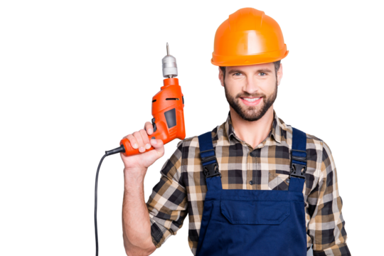 Portrait of handsome attractive repairer in protective hard hat, overalls, shirt with stubble showing having equipment in arm isolated on grey background