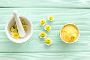 Pharmacy chamomile flowers spa - white mortar with chamomile flowers and sea salt