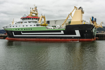 Fototapeta premium factory fishing vessel is moored at the quay of the harbor