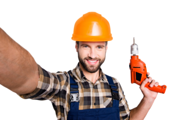 Self portrait of cheerful joyful repairer in protective hard hat shooting selfie on front camera having equipment in hand isolated on grey background. Leisure fun concept