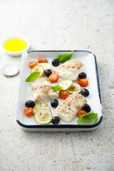 Roasted cod with olives, tomato and zucchini