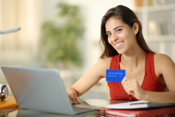 Happy student looks at you buying online
