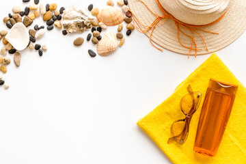 Summer beach sunbathe accessories with straw hat, top view