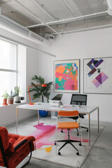 Sleek, minimalist office space with pops of vibrant color and a pristine white frame, awaiting artistic inspiration.