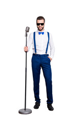 Full size full body portrait of cheerful elegant singer with bristle in blue outfit white shirt...