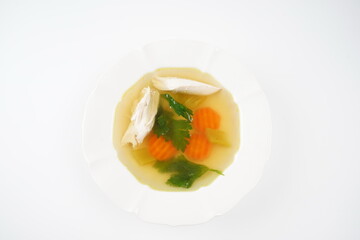 Chicken soup, chicken broth, with pieces of chicken and vegetables. Chicken bouillon, boiled meat