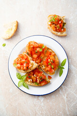Traditional tomato bruschetta with greens