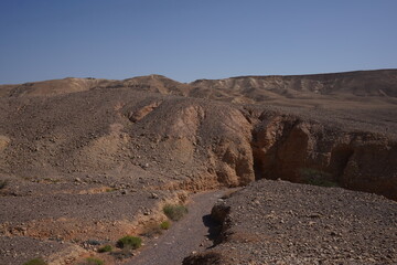 Fototapeta na wymiar The dried up river bed - the path to the Red Canyon, in the national reserve - the Red Canyon , near Eilat, in southern Israel