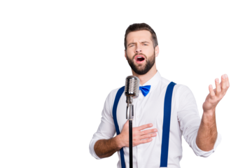 Portrait of talented attractive singer with bristle stubble in elegant classic outfit, singing hit with open mouth in microphone gesture with hand isolated on grey background
