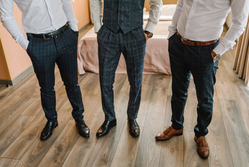 Grooms and groomsmen feet. Fashion, style, beauty. Lifestyle. Men trousers. Best men look. Closeup...