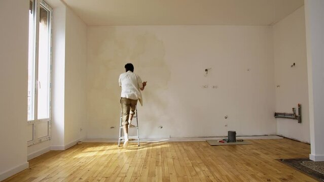 Chalky Limewashed Paint In The Wall Of An Empty Room. Wide Shot