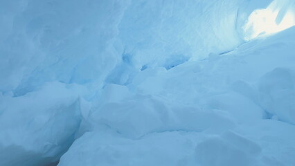 Ice, Snow Covered Cave of Antarctica. Winter Landscape. Snowdrifts, Ice Surface Inside of the...