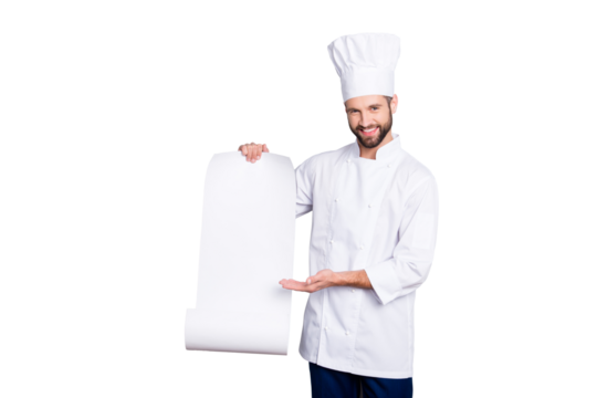 Portrait with empty place of cheerful positive chef cook in beret showing with palm clean open paper roll with empty place for product, isolated on grey background