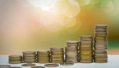 A stepladder made of stacked coins on a blurry background