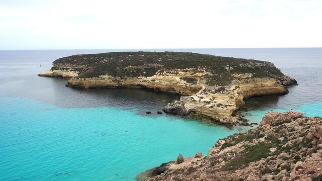 Lampedusa Island, Sicily, Italy - Video of the Rabbit Island with turquoise water at paradise beach.