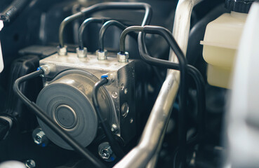 High pressure pump ABS motor control module in the car ( anti-lock brake system). braking system...