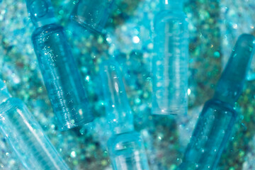 Close-up of blue ampoules with intense moisturizing concentrate with hyaluronic acid and vitamins...