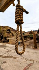 Rope hanging from the roof of a historic building in a quaint town