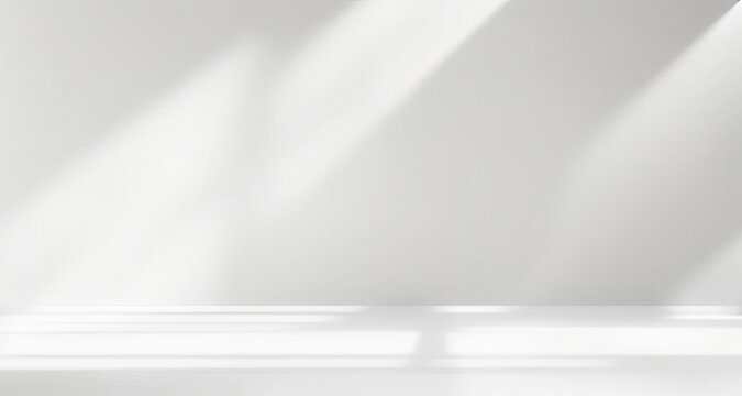 Minimal abstract light gray background for product presentation. Soft shadow and light from windows on white wall.
