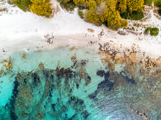 Aerial view of turquoise water and white sand in Sardinia