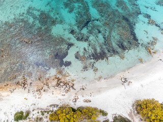 Turquoise water and white sand seen from above