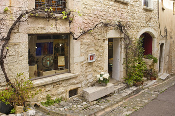 Fototapeta na wymiar Narrow street of downtown in french village Saint-Paul-de-Vence, France