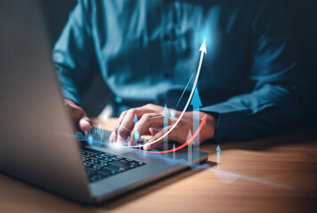 chart, global, graph, index, invest, marketing, report, strategy, growth, statistics. A man is typing on a laptop with a graph of a rising arrow on the screen. Concept of progress and growth.