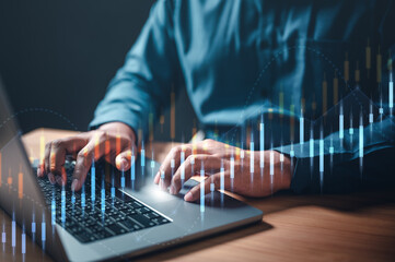 chart, diagram, global, graph, index, invest, marketing, multi, report, information. A man is typing a keyboard with a graph of stock prices on the screen. Concept of focus and concentration.