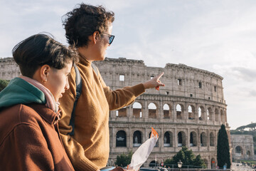 A mother is explaining the history and significance of the Roman Colosseum to her daughter