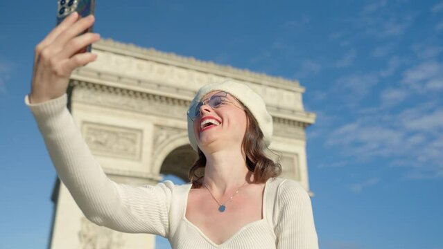 Woman Taking Selfie at Arc de Triomphe