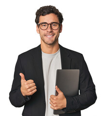 Young Hispanic businessman with laptop smiling and raising thumb up