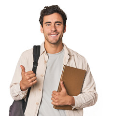Young Hispanic student with notebook smiling and raising thumb up