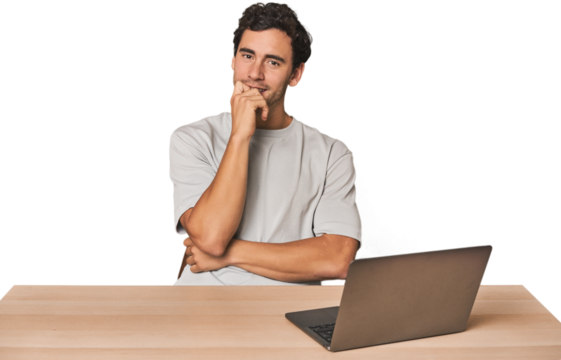 Hispanic young man working on laptop relaxed thinking about something looking at a copy space.