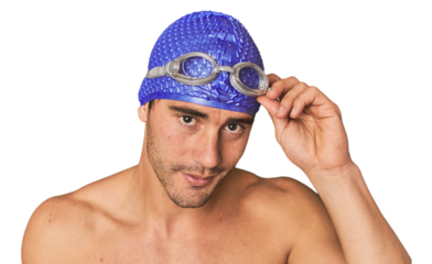 Close-up of Hispanic male swimmer with goggles, winner's attitude