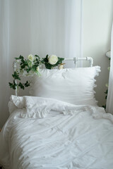 Rustic bed with flowers, white cotton linen. Metal Frame.
