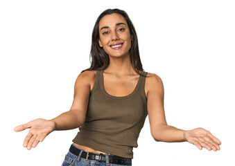 Fototapeta premium Hispanic young woman showing a welcome expression.