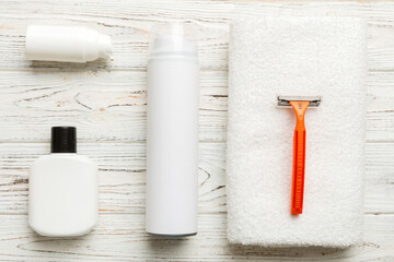 shaving man set. shaving machine, towel, lotion and shaving foam on colored background. Men bath...