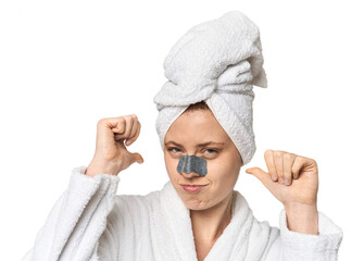 Young Caucasian redhead with pore strip feels proud and self confident, example to follow.