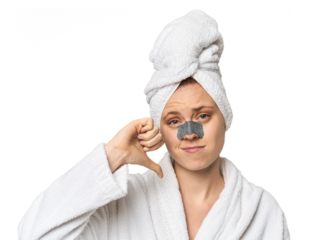 Young Caucasian redhead with pore strip showing a dislike gesture, thumbs down. Disagreement concept.