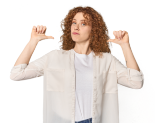 Young Caucasian redhead woman feels proud and self confident, example to follow.