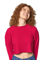 Young Caucasian redhead woman relaxed and happy laughing, neck stretched showing teeth.