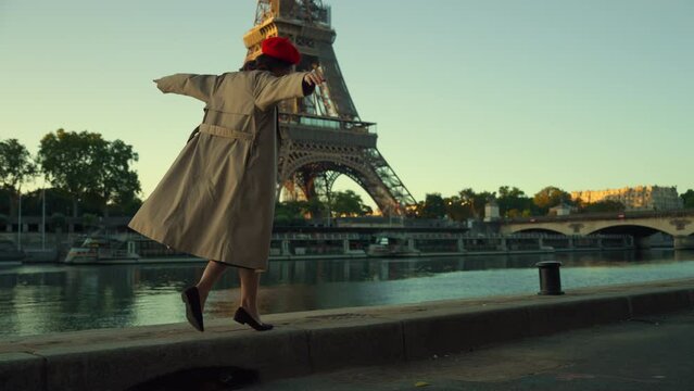 Joyful Woman Posing by the Eiffel Tower