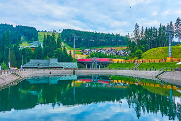 The mirror-like pond in Bukovel mountain resort, Carpathians, Ukraine