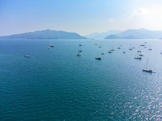 View of Marmaris beach, Aegean Sea, marina, sailboats in city of Turkey. Aerial view of harbor....