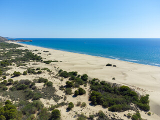 Beautiful sandy beach of Patara with blue sea, Kalkan, Antalya, Turkey. Drone view of the sandy beach, the length of the Mediterranean coast and the longest sandy beach